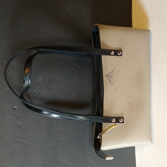 Beijo a pearlized gold color with black straps and trim. - Picture 2 of 14